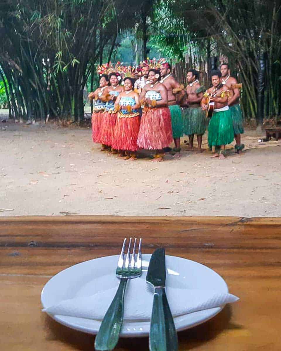 Watching a dance performance during dinner at the Fiji Cultural Village