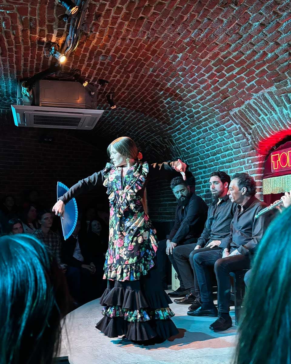 A woman dances flamenco at a show in Madrid