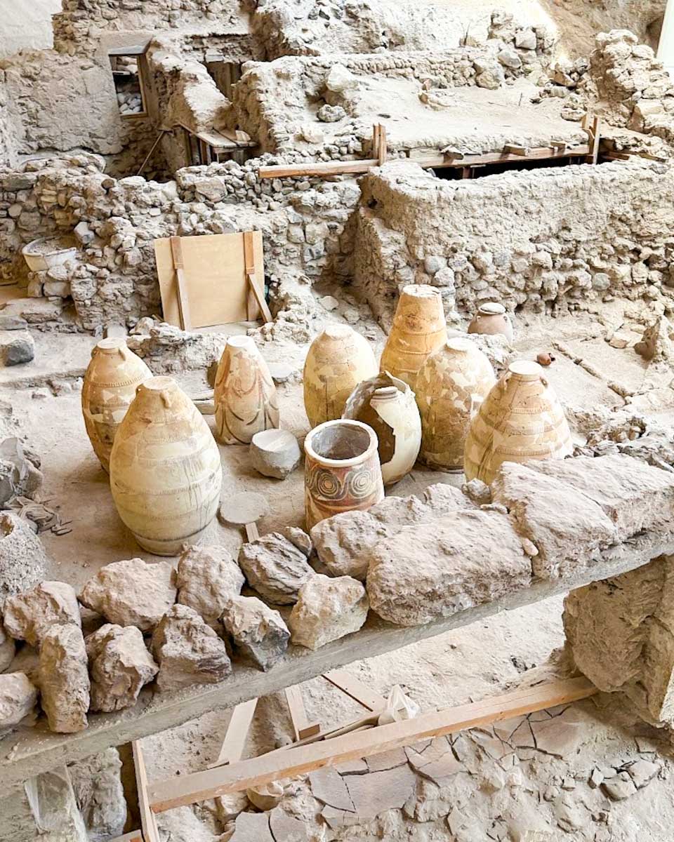 Ancient ruins and pottery displayed at the Akrotiri Archaeological Site in Santorini Greece