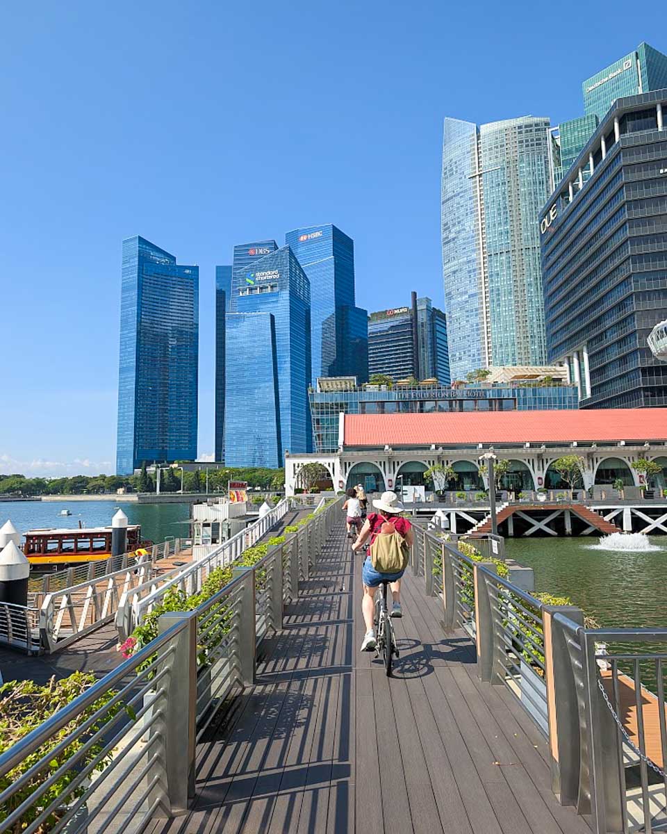 Bailey and Daniel cycling along the waterfront in Singapore