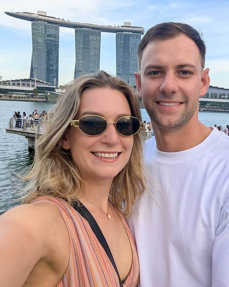 Daniel and Bailey taking a selfie with Marina Bay Sands behind them