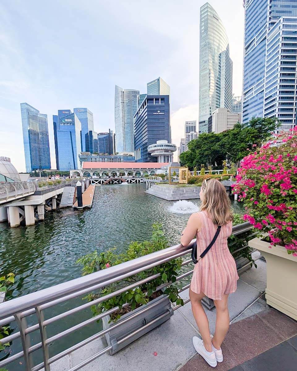 Bailey admiring the Marina Bay skyline from Singapore's waterfront promenade
