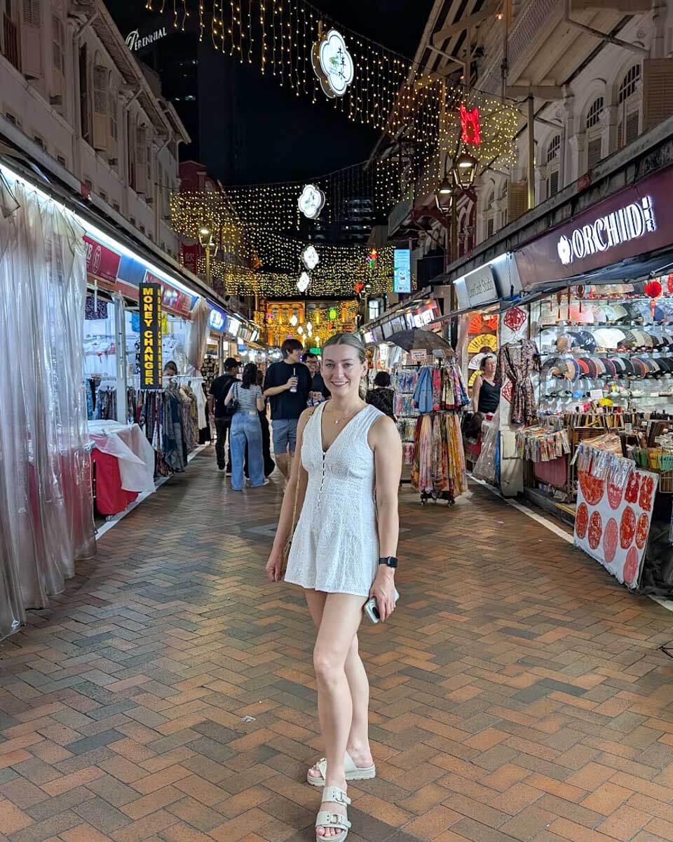 Bailey walking through the colorful streets of Chinatown in Singapore