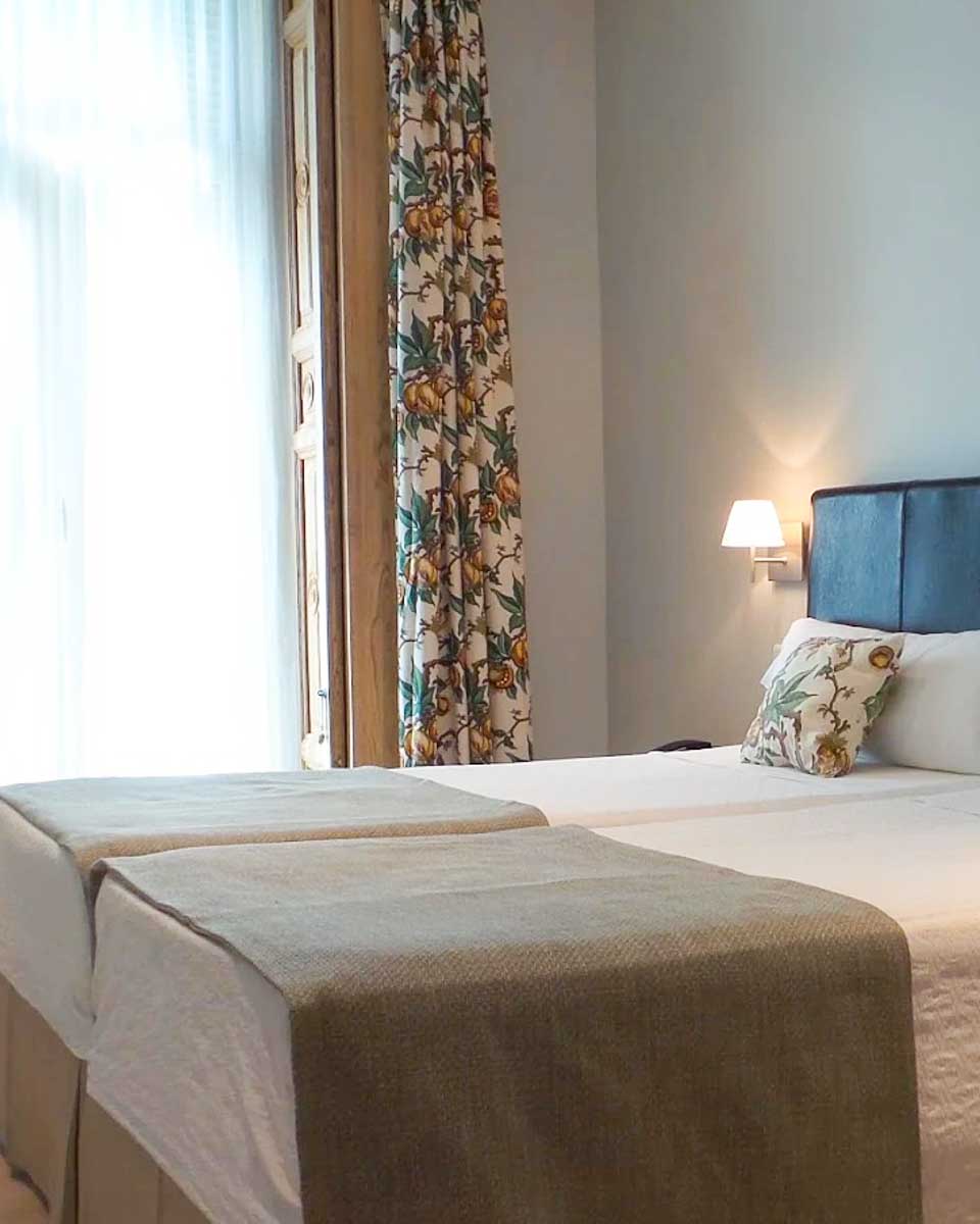 Bed in the hotel room at Hotel Moderno Puerta del Sol in Madrid copy