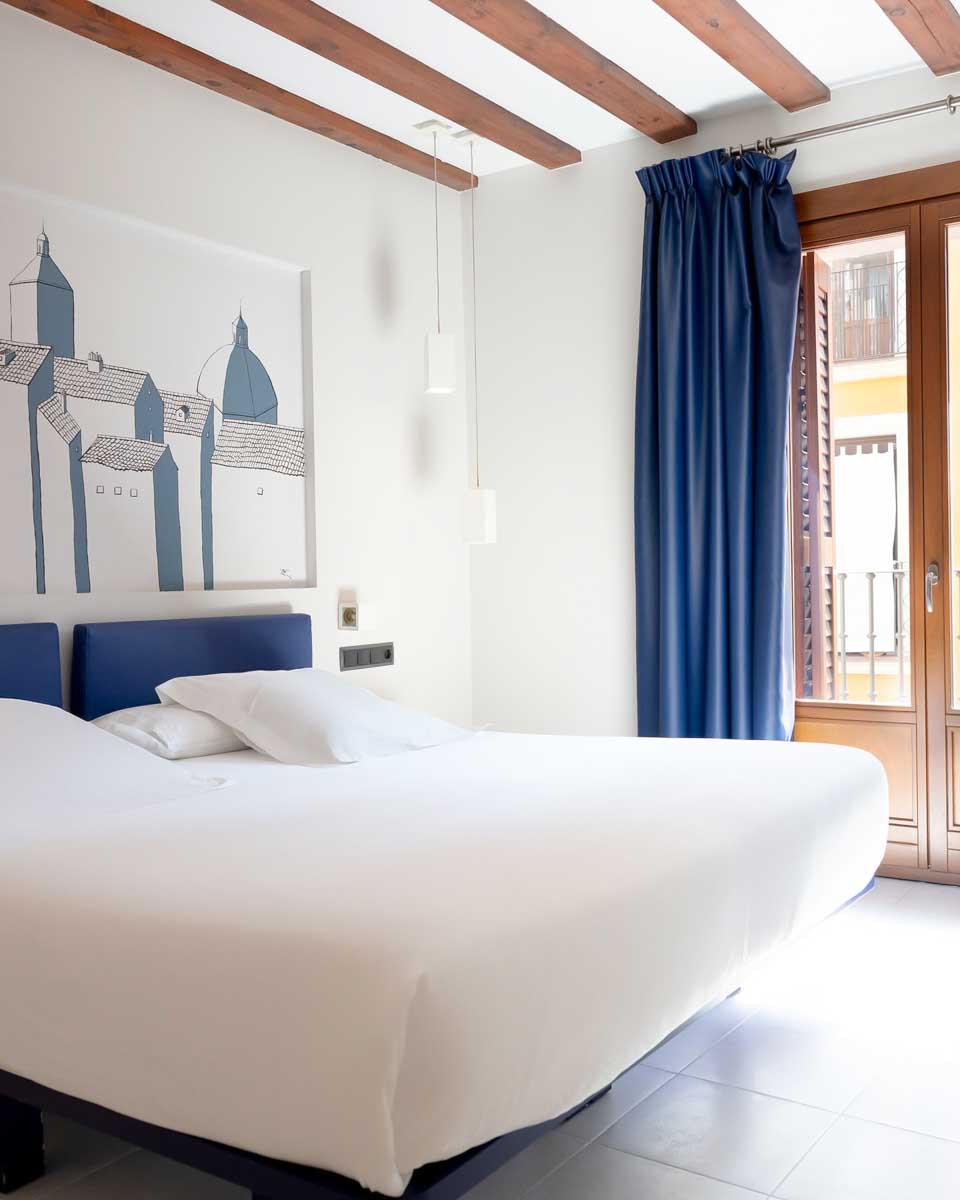 Bed in the hotel room at Posada del León de Oro Boutique Hotel in Madrid