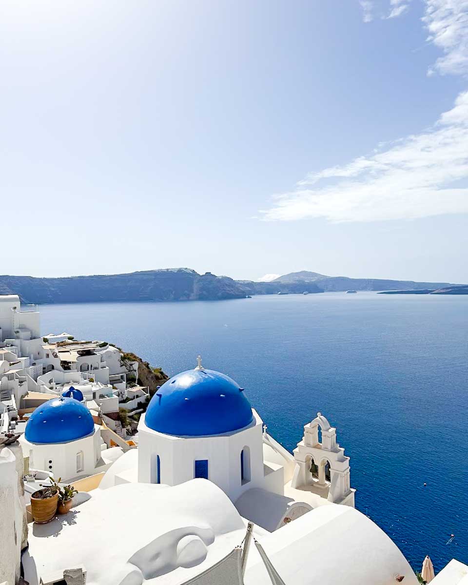 Blue-domed churches overlooking the caldera in Oia, Santorini