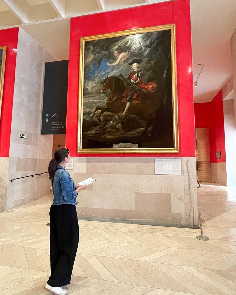 Brittni admires a painting in the Prado Museum Madrid