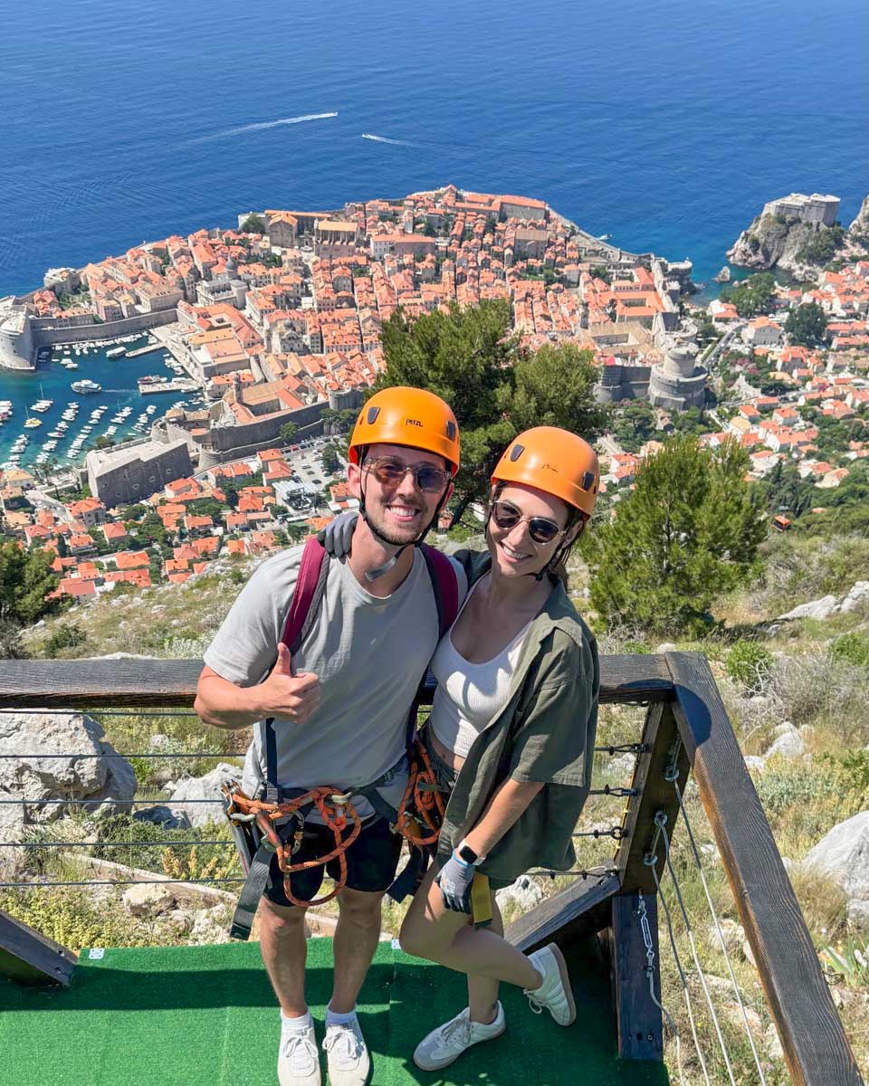 Brittni and Jesse pose while ziplining in Dubrovnik