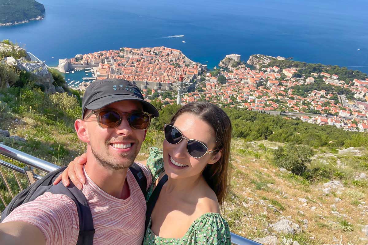 Brittni and Jesse take a picture from the top of Mt Srd with Old Town Dubrovnik in the background