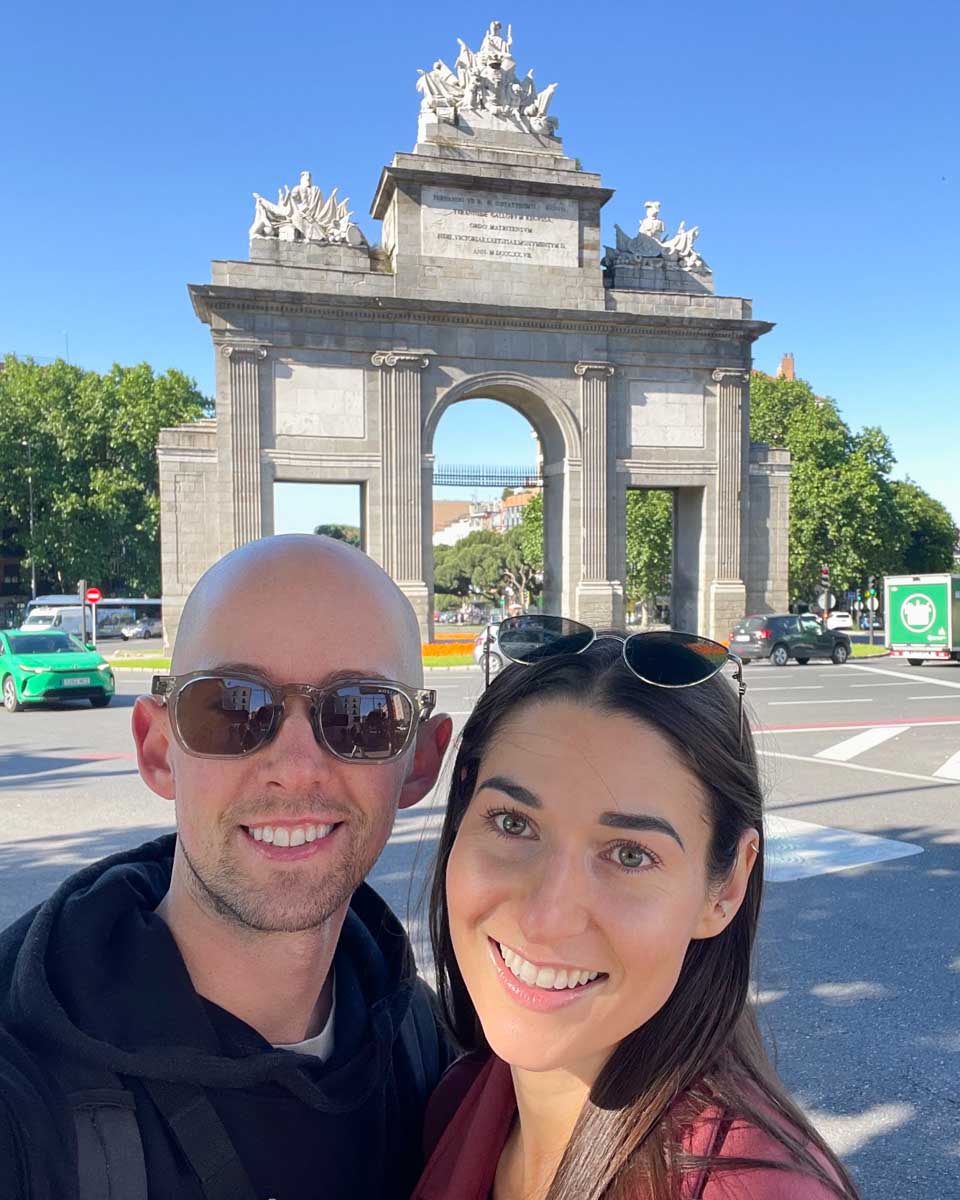 Brittni and Jesse take a selfie infron tof the Toledo Gate in Madrid