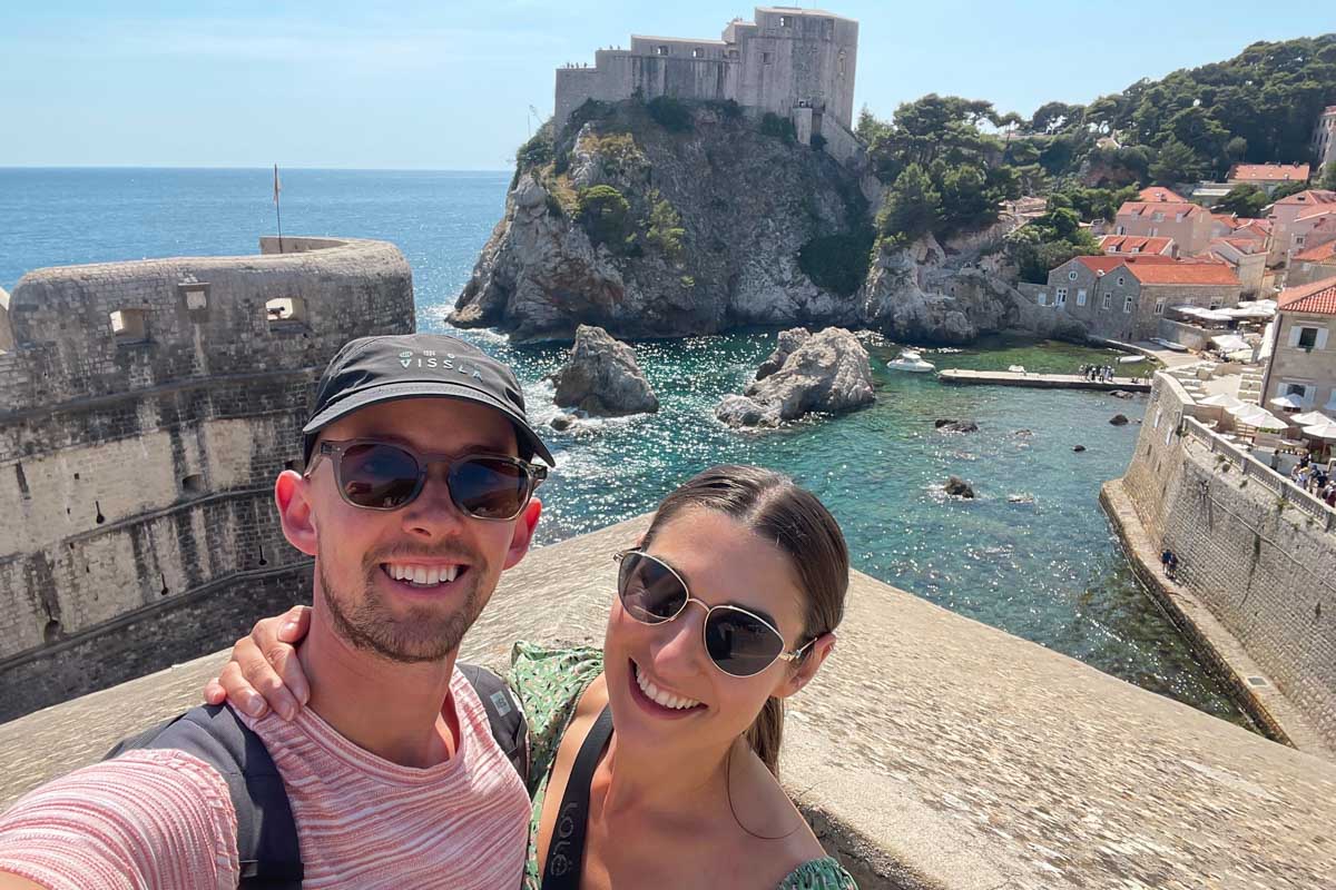 Brittni and Jesse take a selfie with Fort Lovrjenac in the background in Dubrovnik