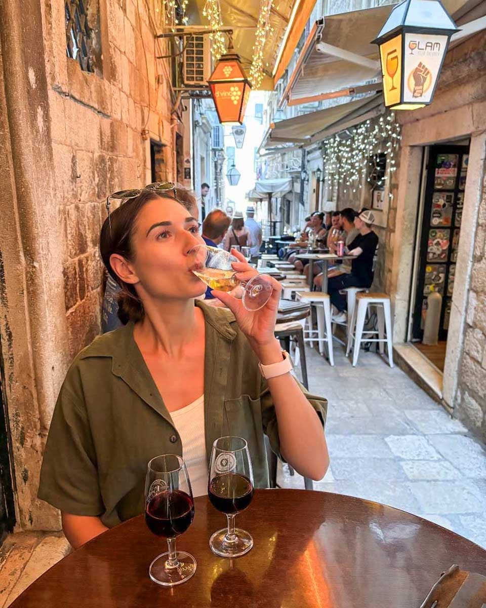 Brittni-drinks-wine-at-DVino-wine-bar-in-Dubrovnik