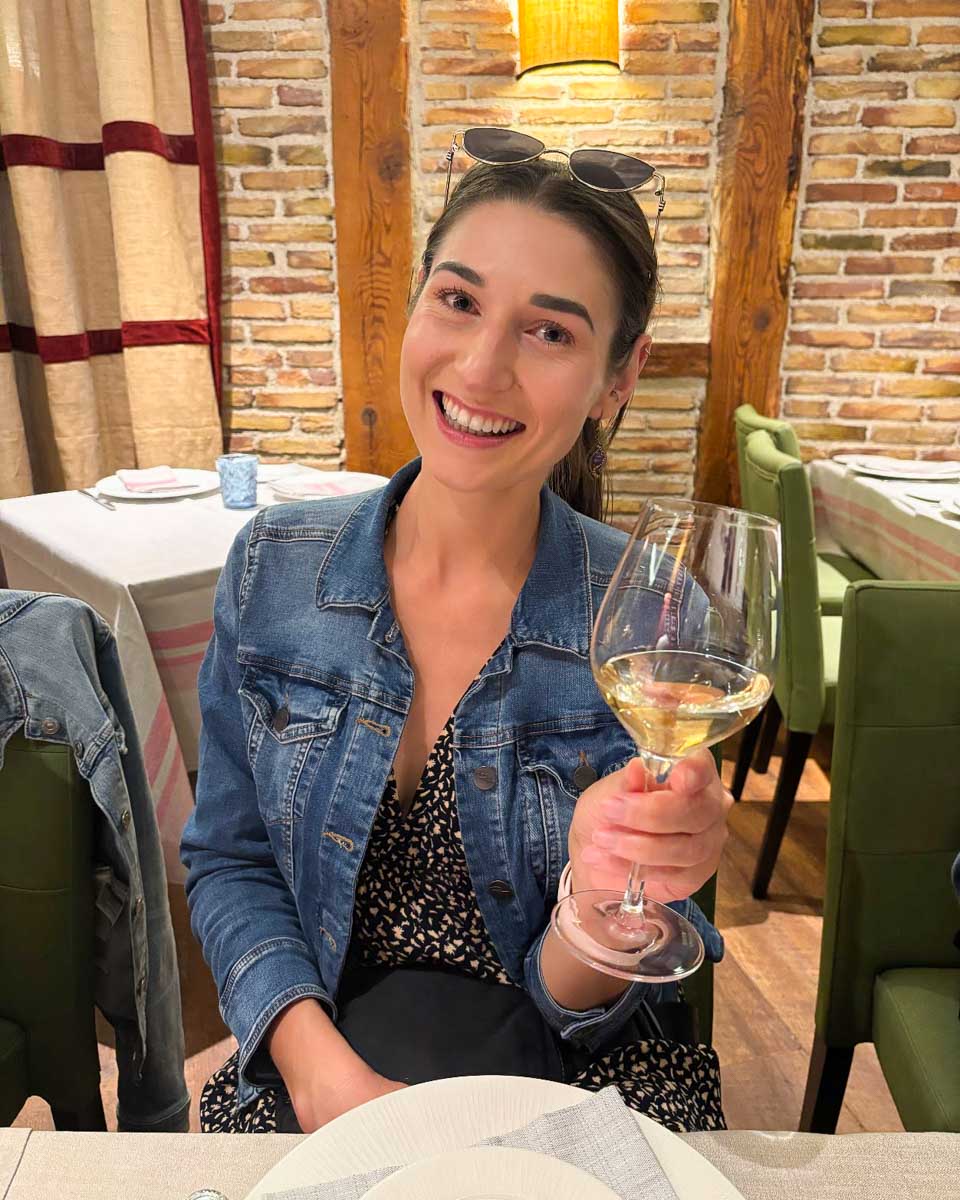 Brittni enjoys a glass of wine on a tapas tour in Madrid