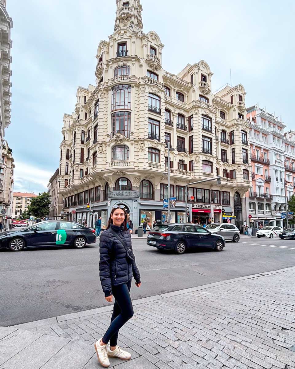 Brittni poses for a photo on Gran Via street in Madrid