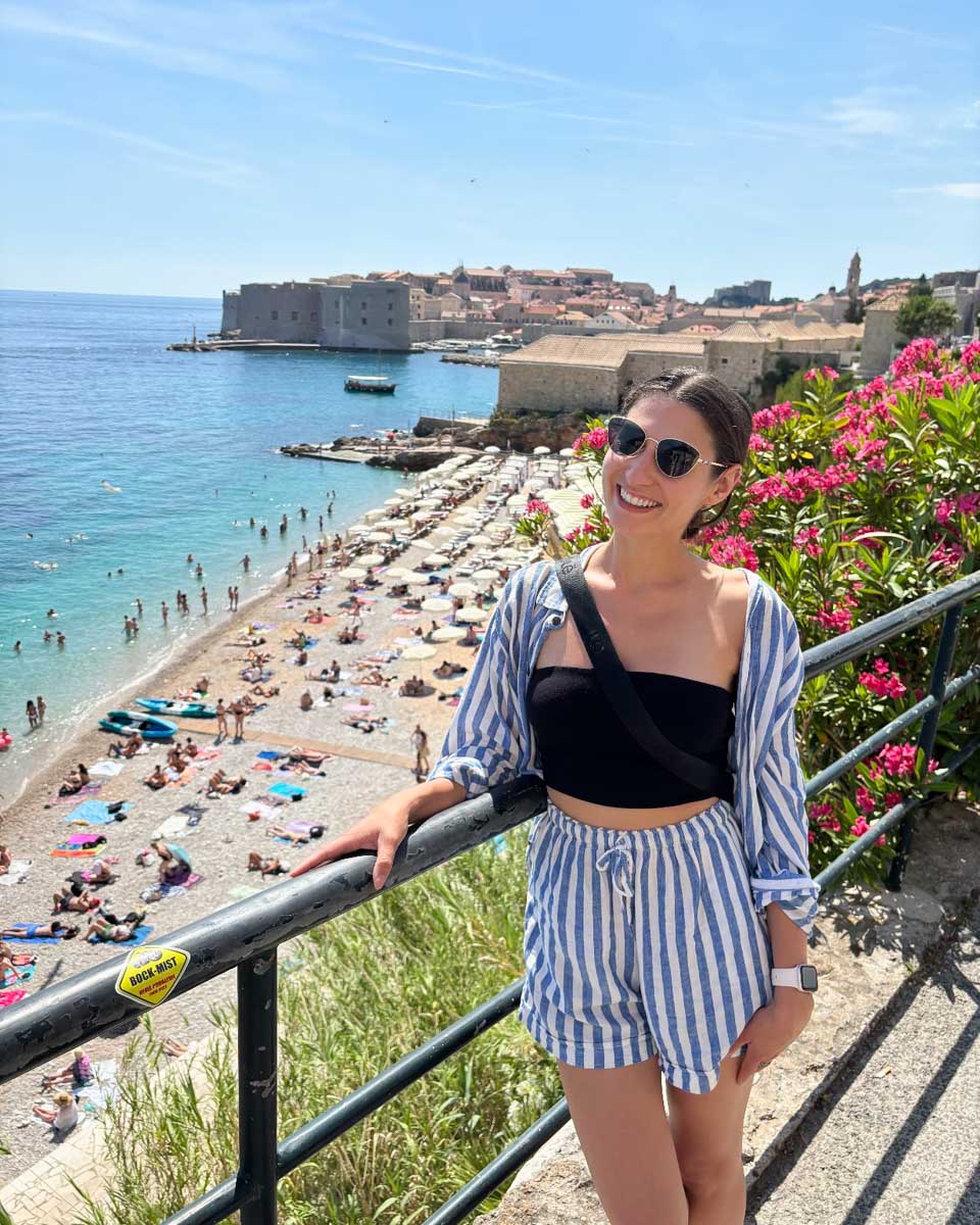 Brittni poses with Banje Beach in the background in Dubrovnik