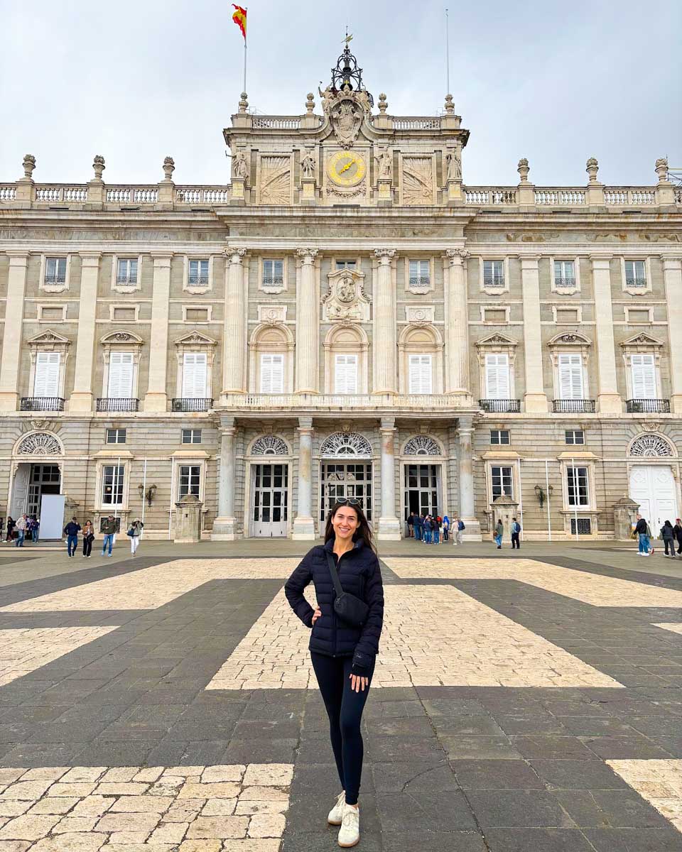 Brittni stands in front of the Royal Palace in Madrid