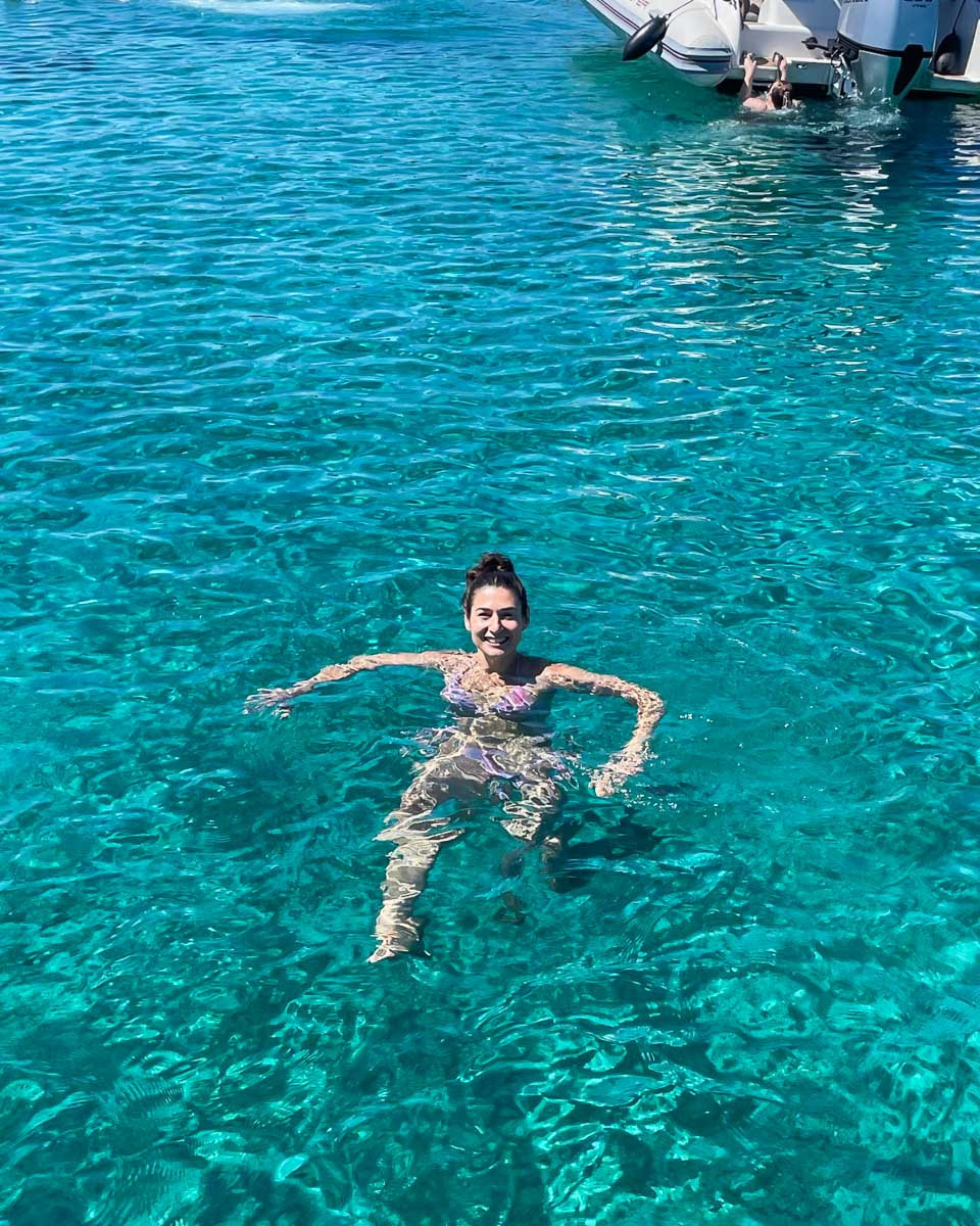 Brittni swims in the water on a boat tour from Dubrovnik