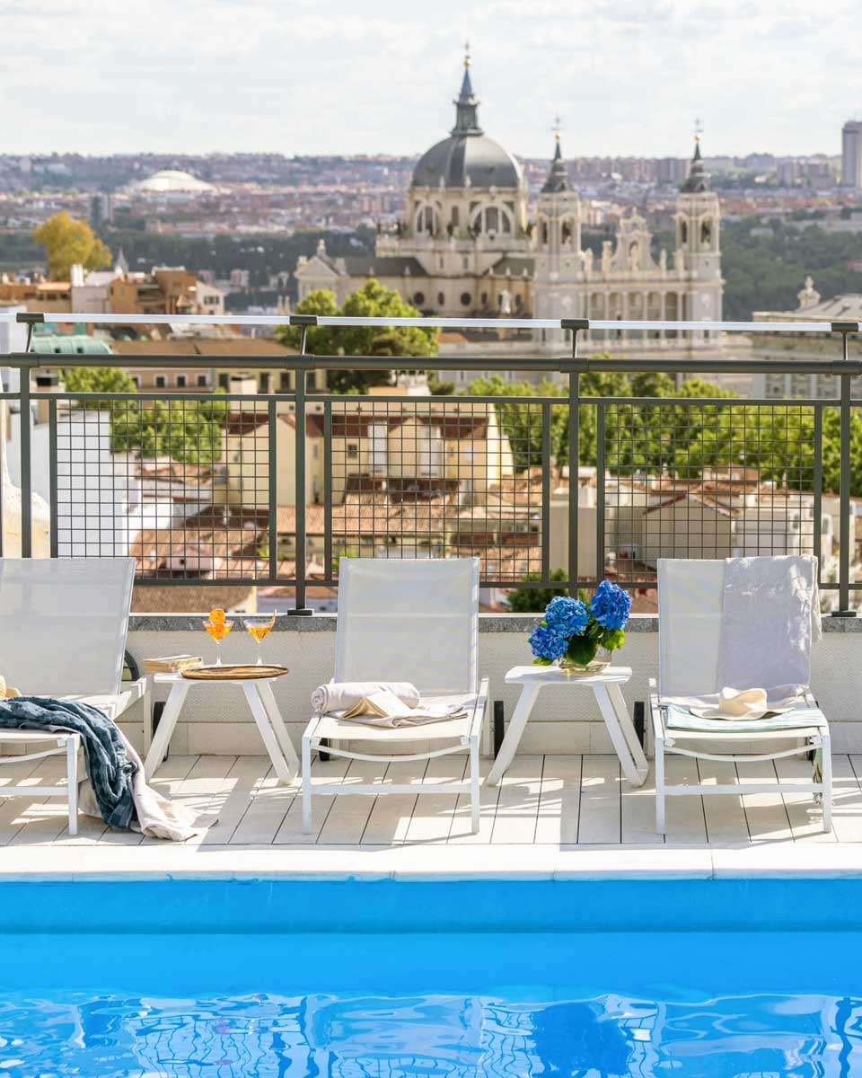 Chairs at the rooftop pool of Hotel Emperador in Madrid