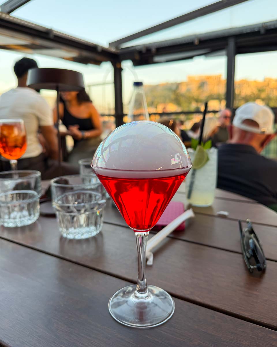 Creado red drink at Attic Urban Rooftop in Athens Greece on Hannah trip