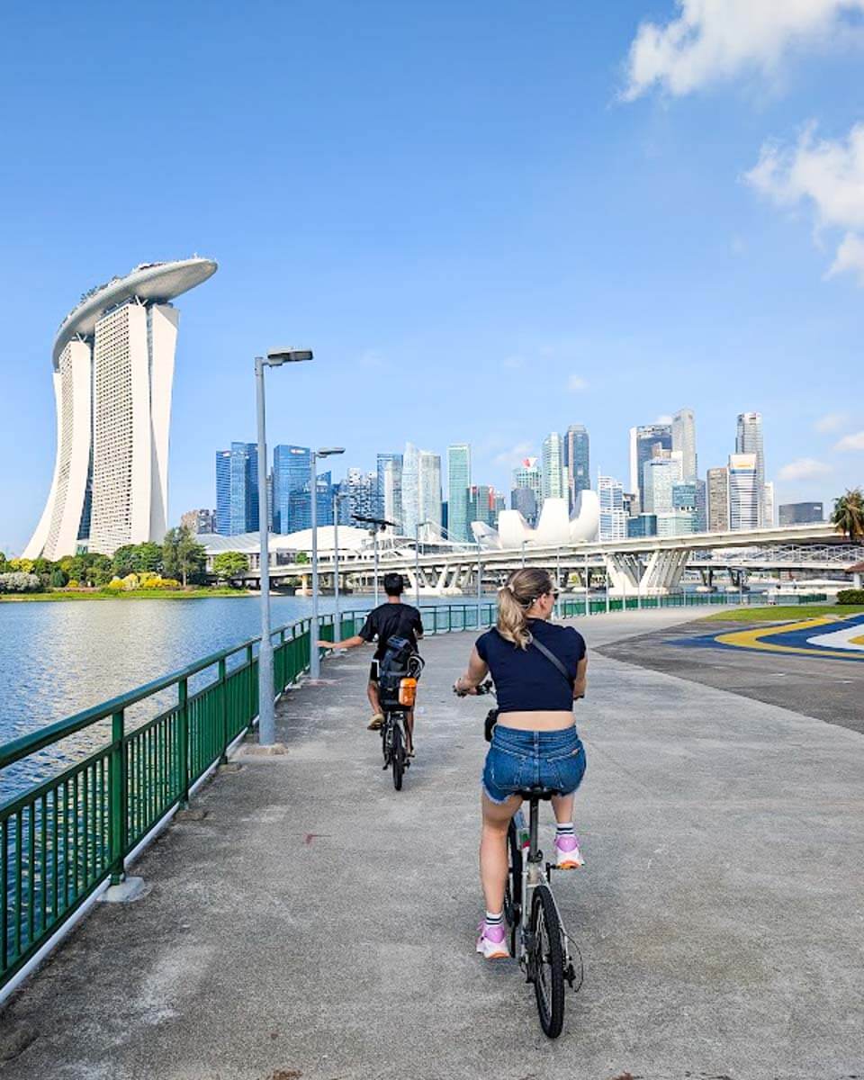 Daniel and Bailey cycling along Marina Bay in Singapore