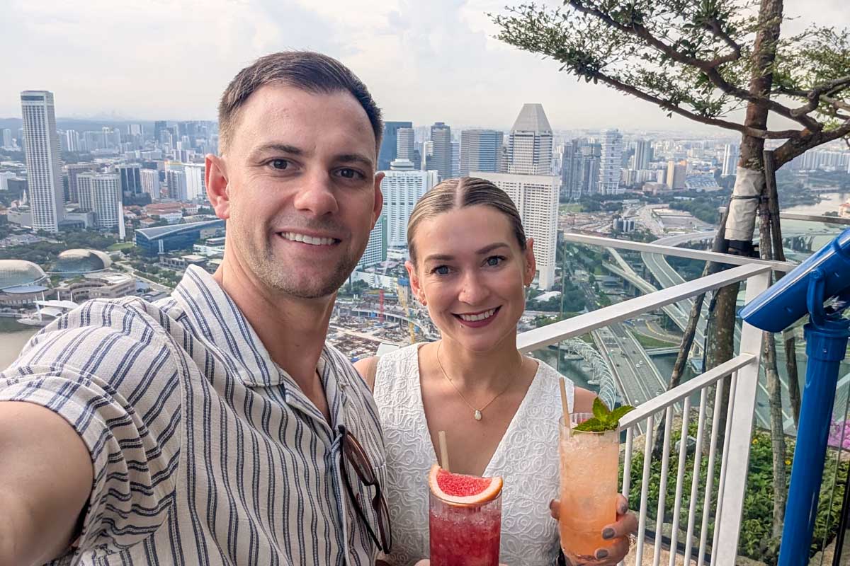 Daniel and Bailey taking a selfie on a rooftop bar in Singapore