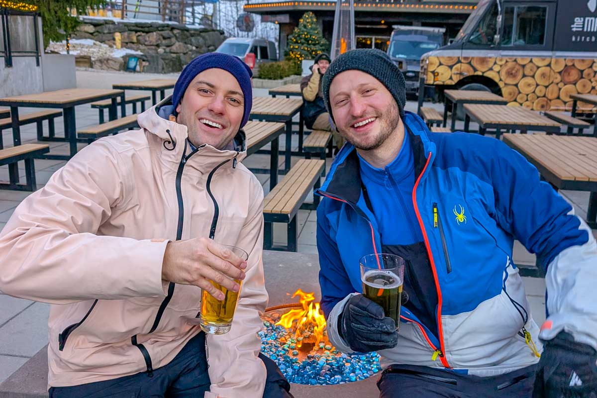 Daniel and friend drink a beer in Iceland