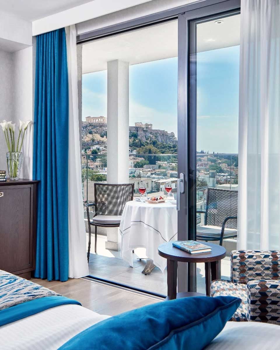 Guest room at Electra Metropolis Athens with a balcony overlooking the Acropolis
