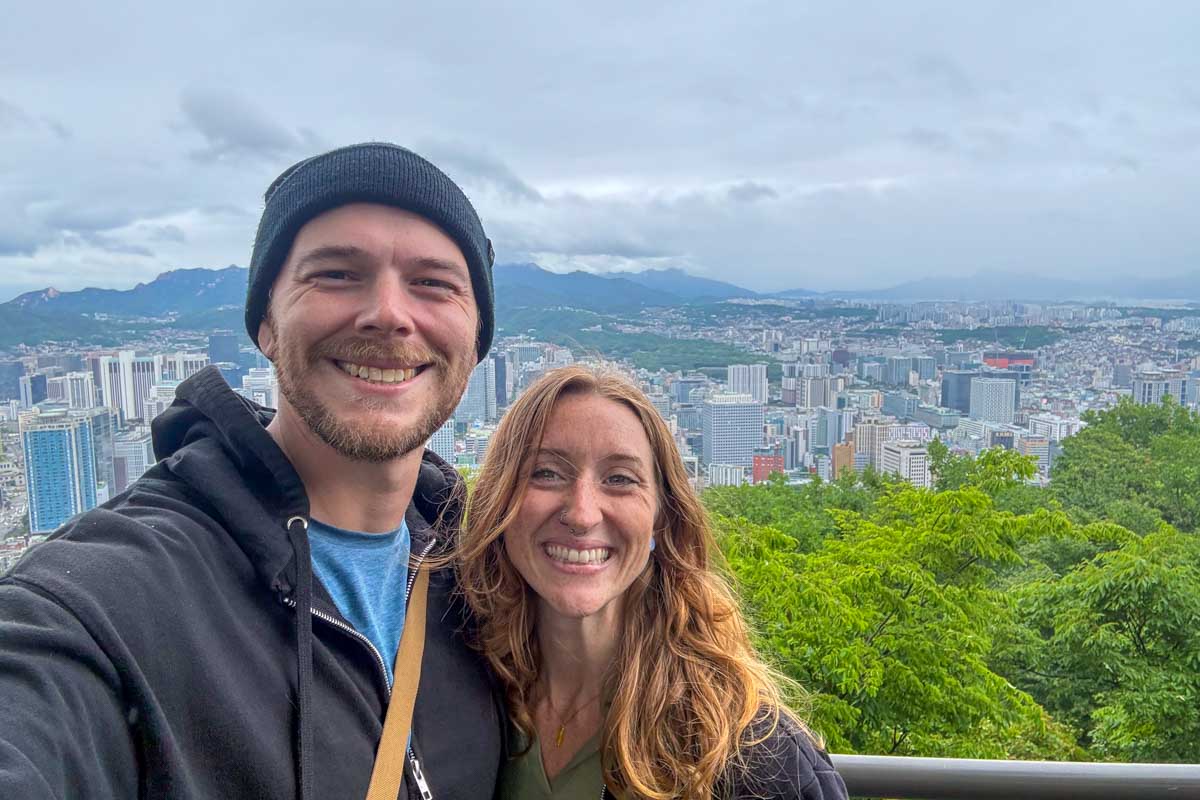 Evan and Meghan take a selfie on a rainy day at the top of Namsan Mountain in Seoul South Korea 1