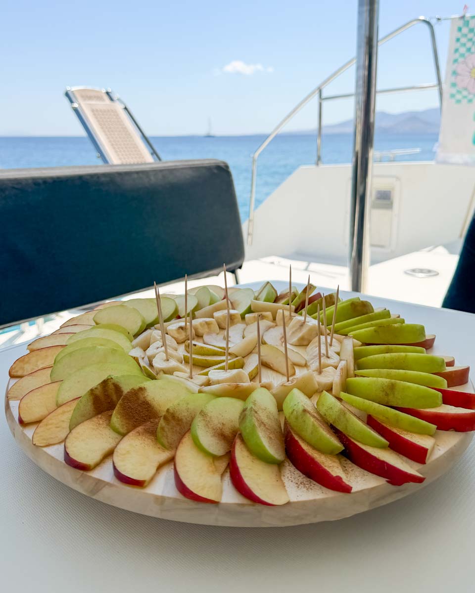 Fruit with cinnamon on a catamaran cruise in Naxos cruise on Hannah trip