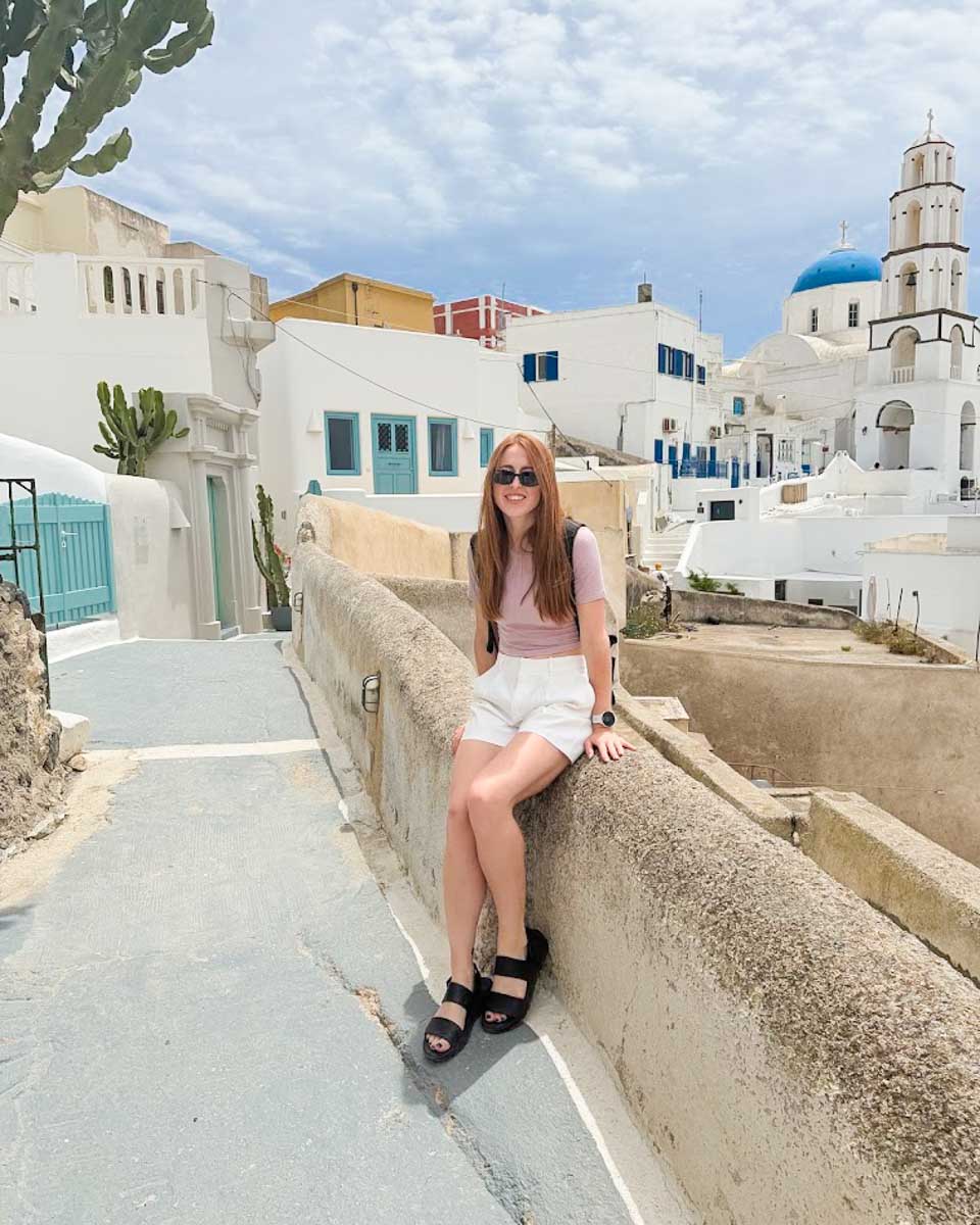 Hannah walking through the streets of Pyrgos in Santorini