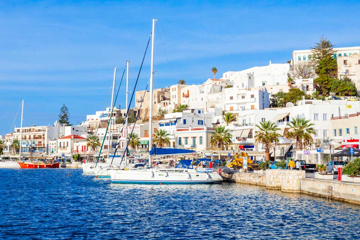 Sailboats moored along the waterfront in Naxos Town, Greece
