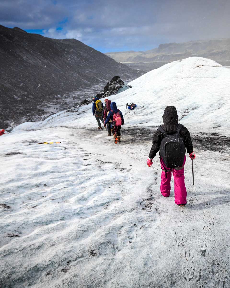 People on the Sólheimajökull Glacier Hike seen near Vik Iceland 1