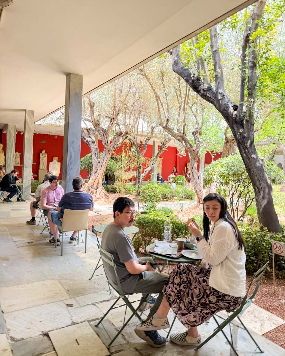 People sitting at the National Archaeological Museum in Athens Greece on Hannah trip
