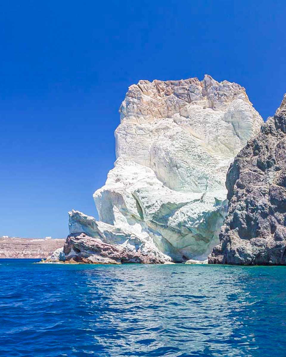 White Beach cliffs viewed from a boat cruise in Santorini Greece