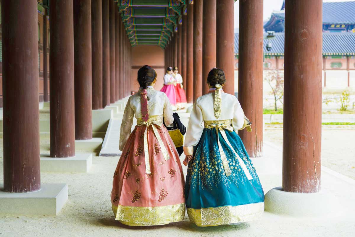 Women dressed in Hanbok at Gyeongbokgung Palace in Seoul South Korea 1