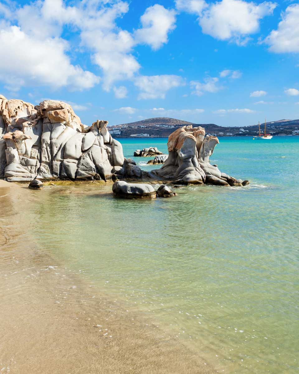 Granite rock formations and turquoise water at Kolymbithres Beach in Paros