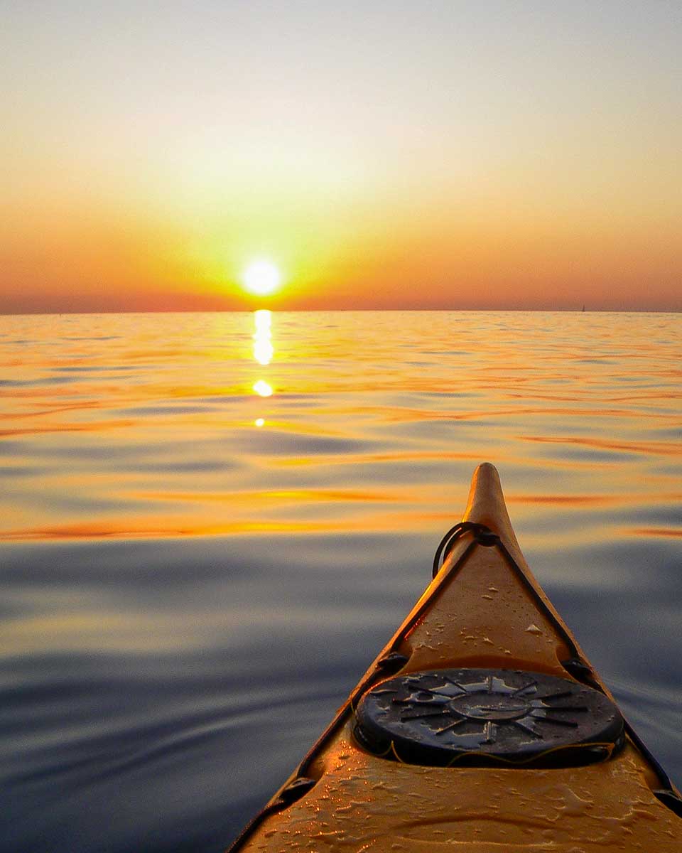 A-kayak-in-the-sea-at-sunset-on-a-tour-from-Virginia Beach, Virginia