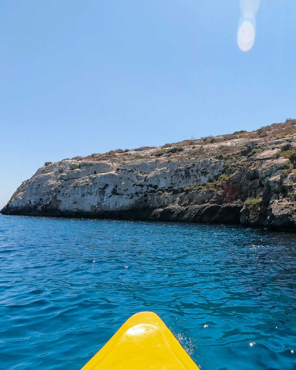 A person kayaking through Santorini Island in Greece