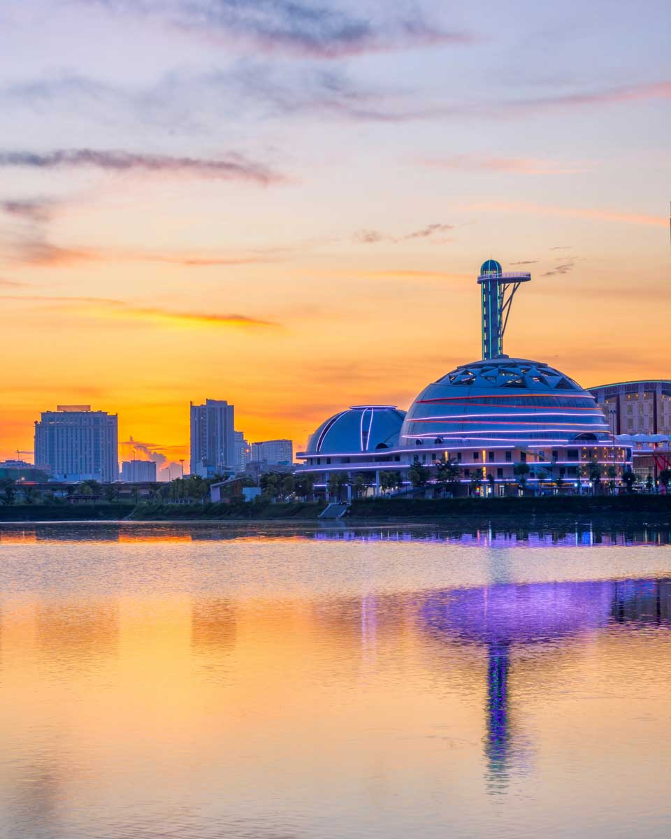 A vibrant sunset reflects across Cau Giay Lake Park in Hanoi