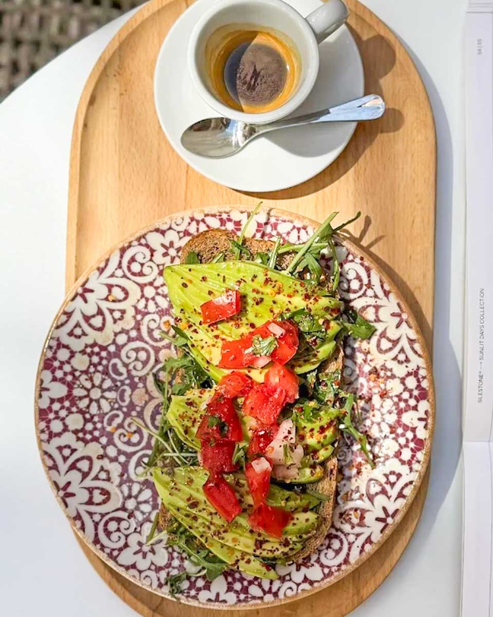 Avocado toast and coffee at Mi Cafecito Brunch & Bistro in Malaga, Spain copy