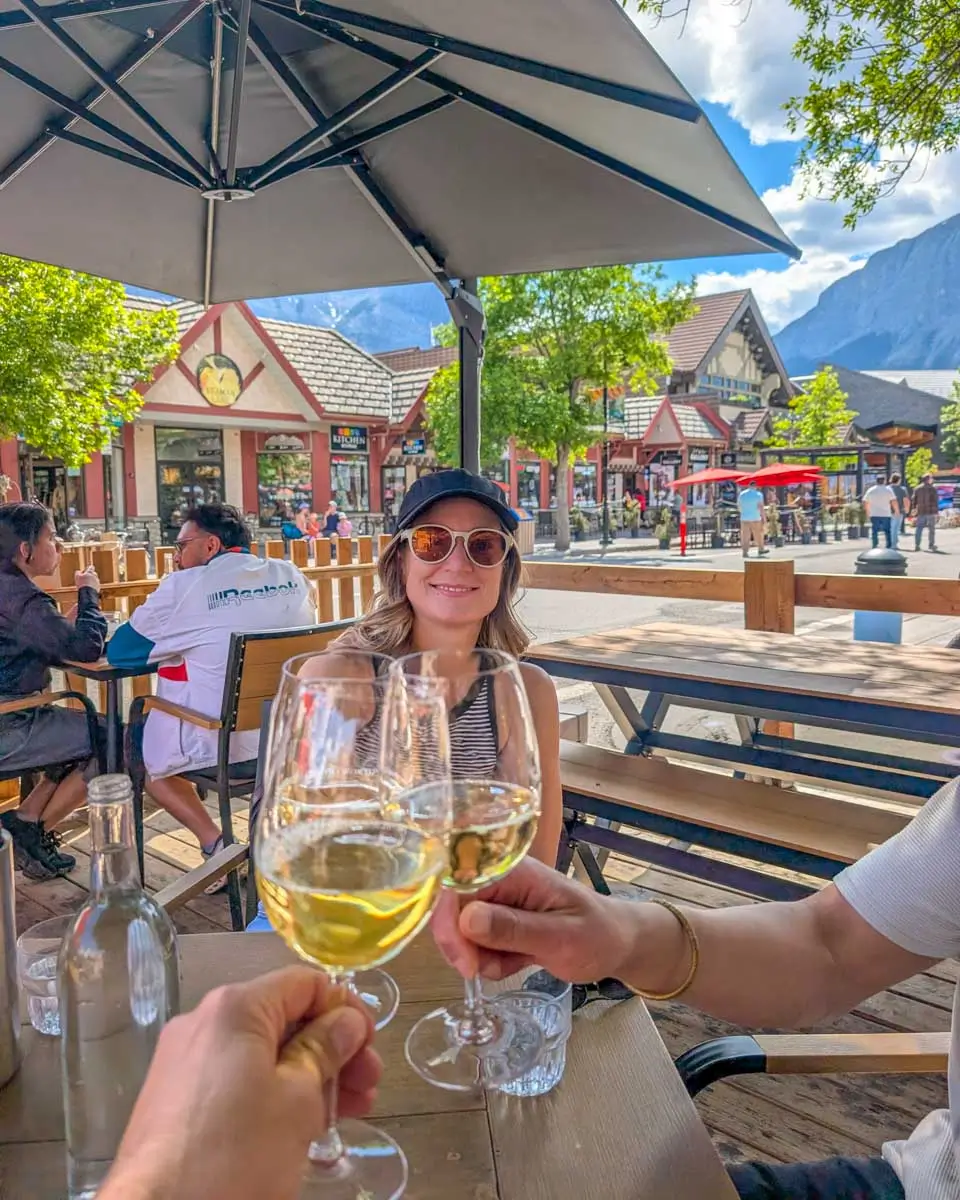 Bailey, Daniel and friend drink wine in Downtown Canmore, Alberta, Canada
