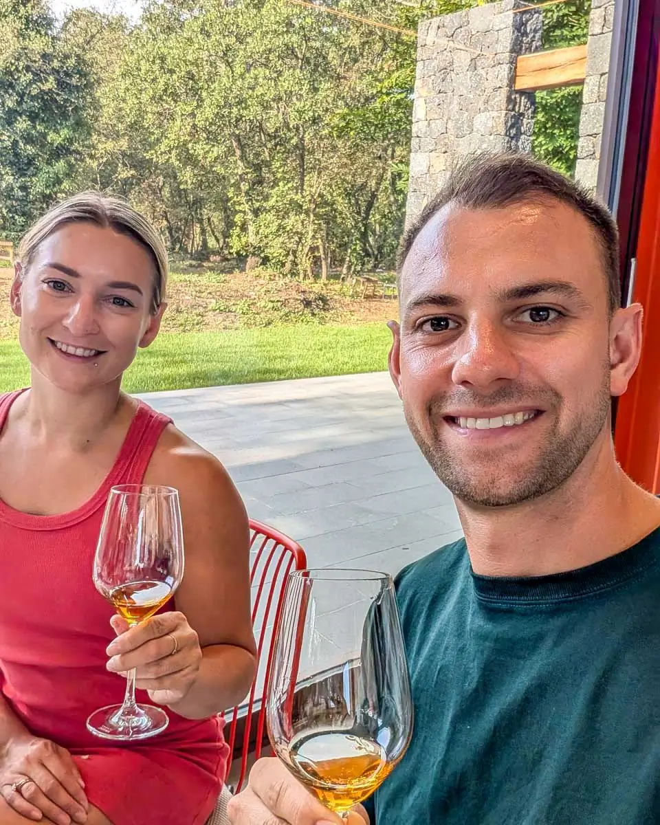 Bailey and Daniel having a drink on a wine tour in Syracus, Italy