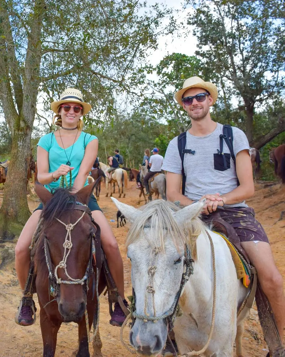 Bailey and Daniel ride horses while on a day tour from Punta Cana, Dominican Republic