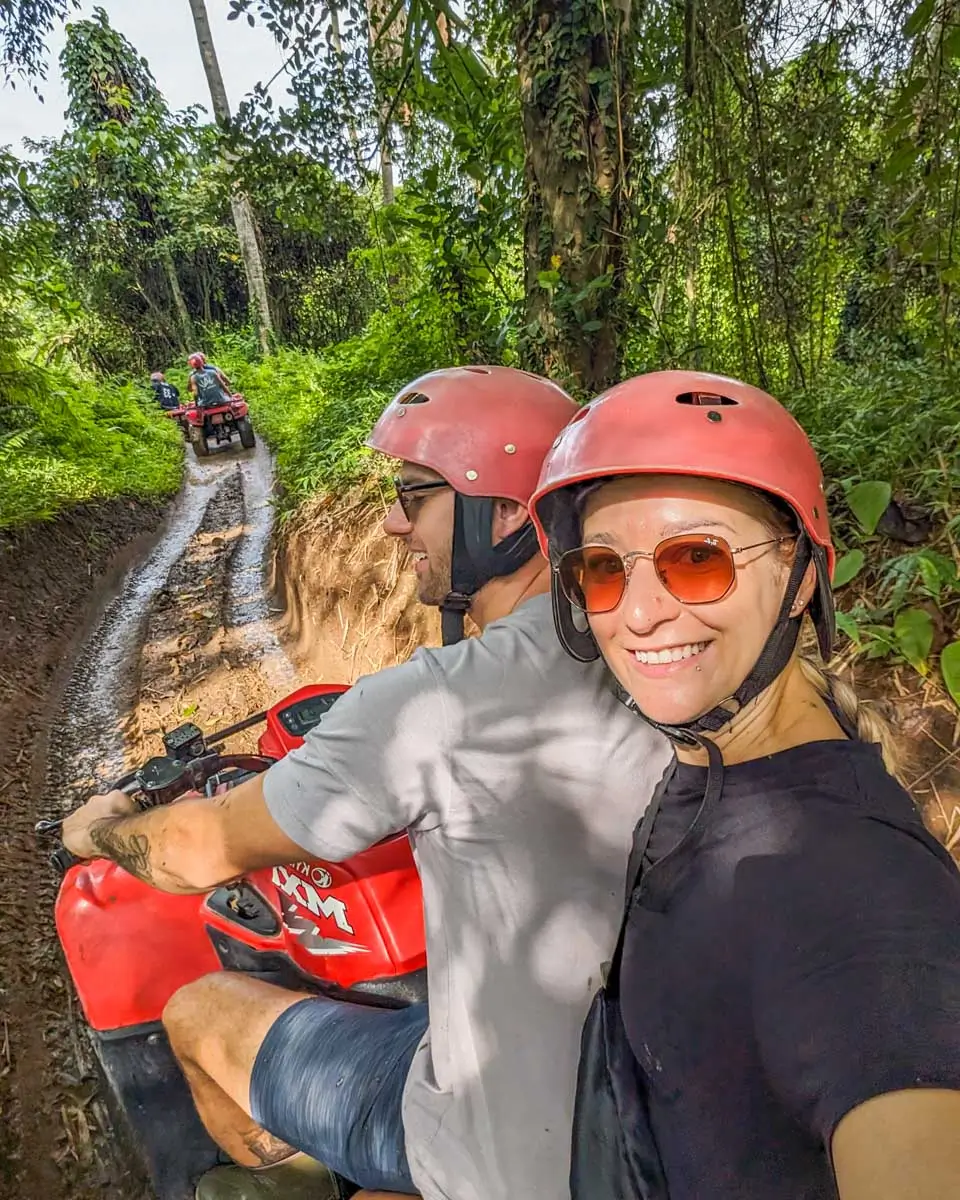 Bailey and Daniel taking a selfie while riding on an ATV in Cozumel, Mexico