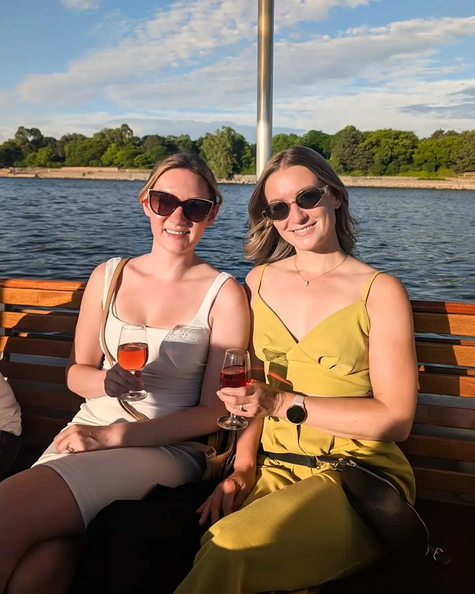 Bailey and her friend enjoying drinks on the river cruise tour in Montreal, Quebec