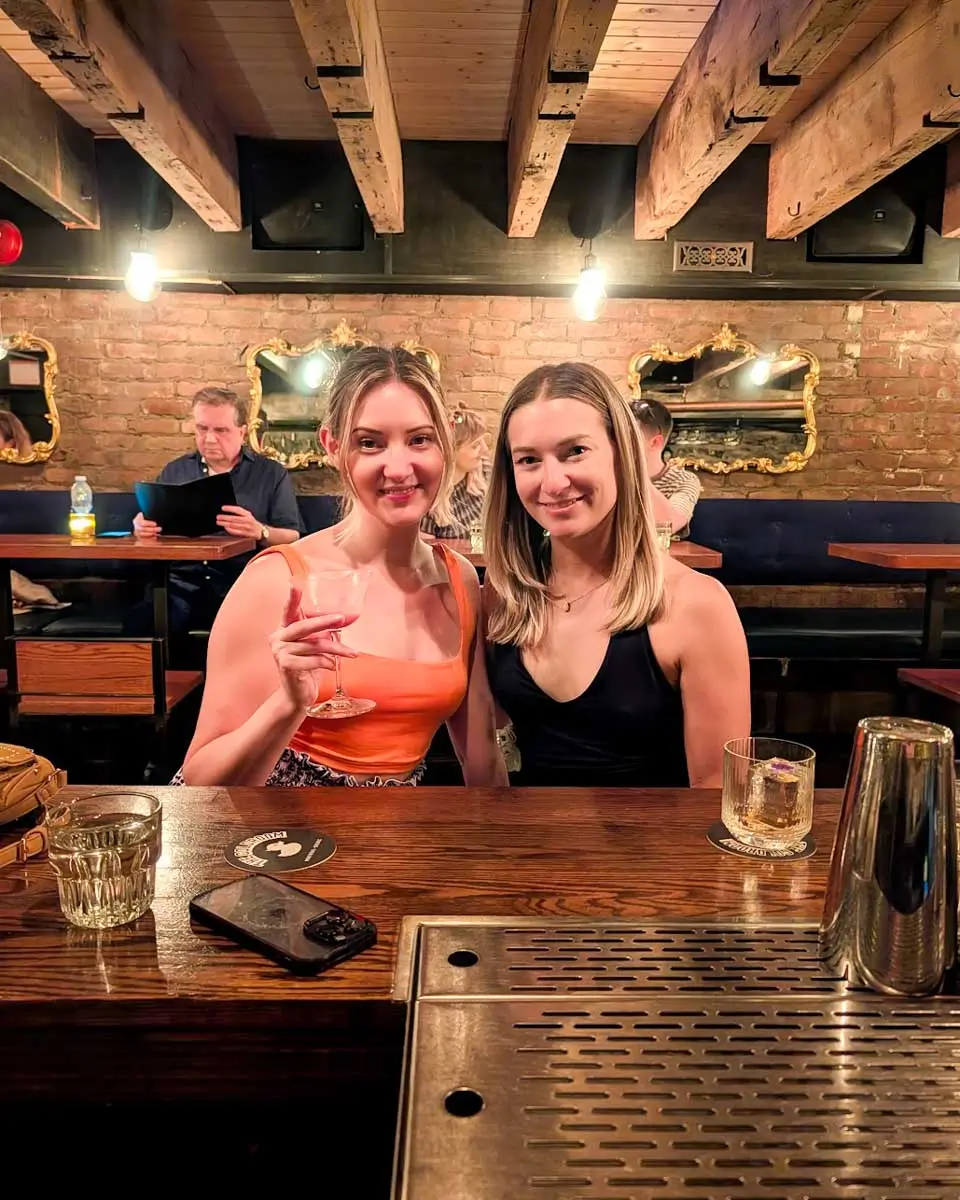 Bailey and her friend posing at the Coldroom speakeasy in Montreal, Quebec