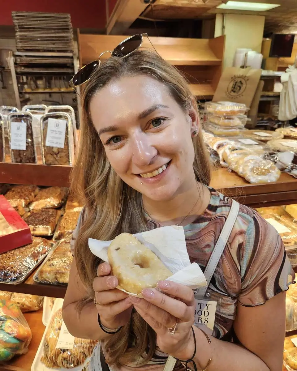 Bailey eating a donut at Jean-Talon Market, Montreal