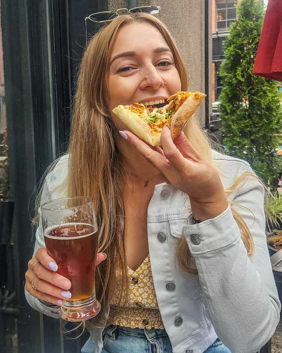 Bailey eating pizza at a restaurant in Salerno, Italy