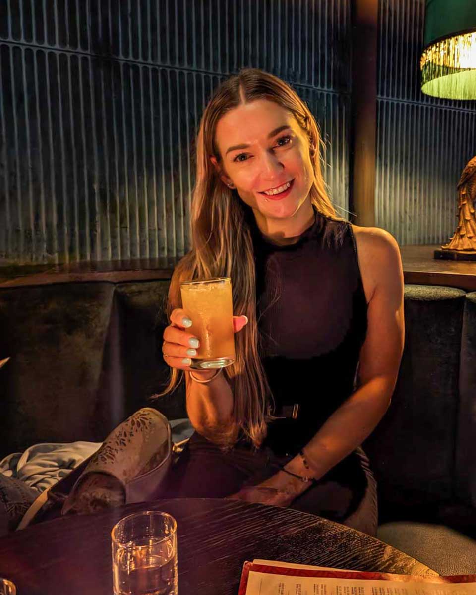Bailey-enjoys-a-cocktail-in-Boulder-Colorado