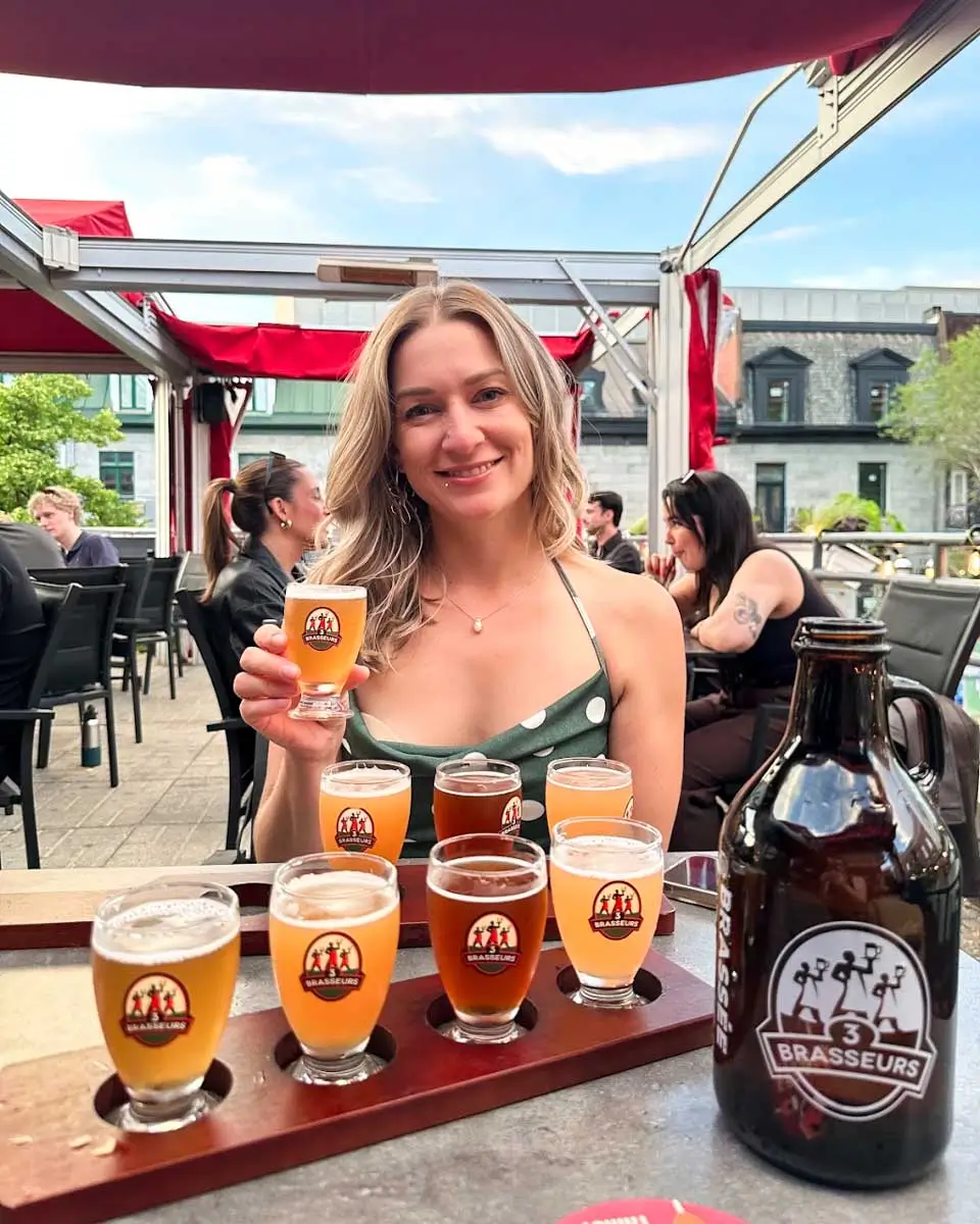 Bailey holding beer at the 3 Brasseurs Saint-Paul in Montreal, Quebec